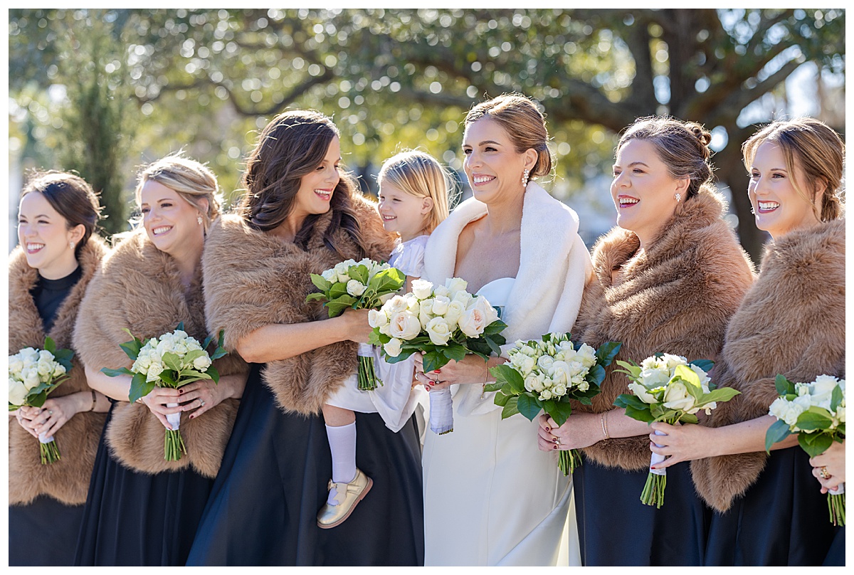 Black and white bridesmaid dresses with brown fur boleros